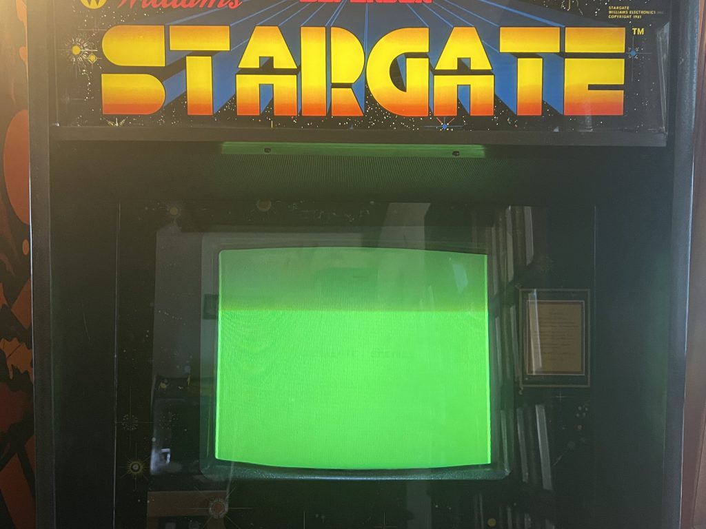Image of Stargate Arcade Machine with Green Screen of Death