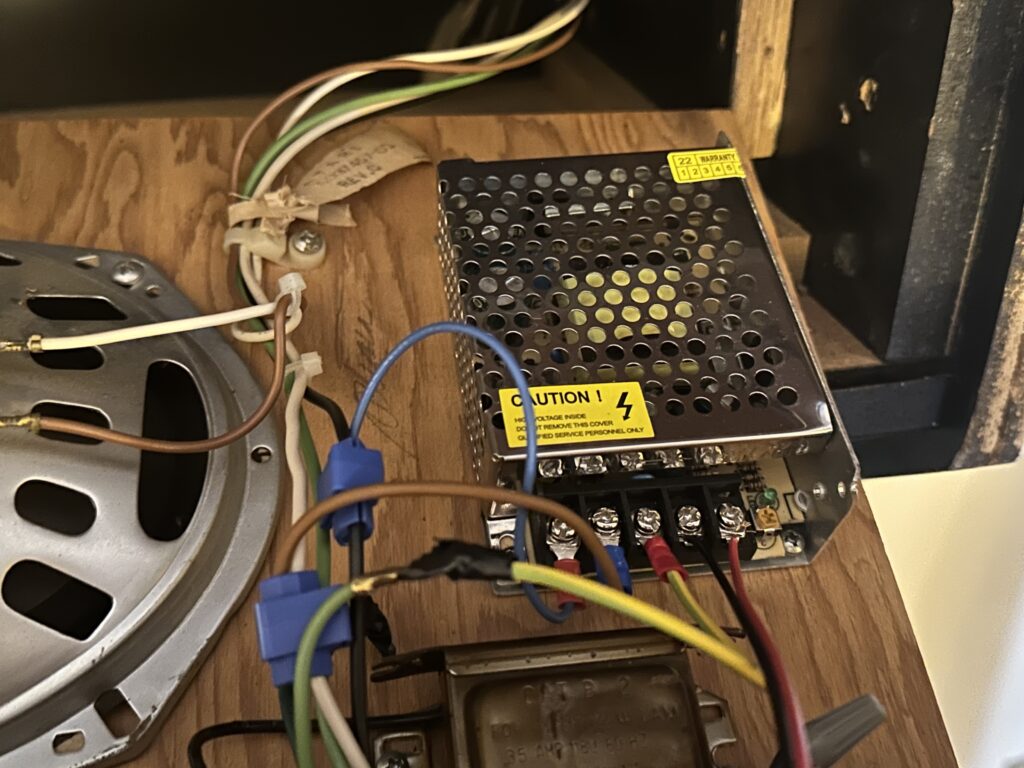 Image of 12 volt switching power supply in Dig Dug cabinet to enable LED marquee to work