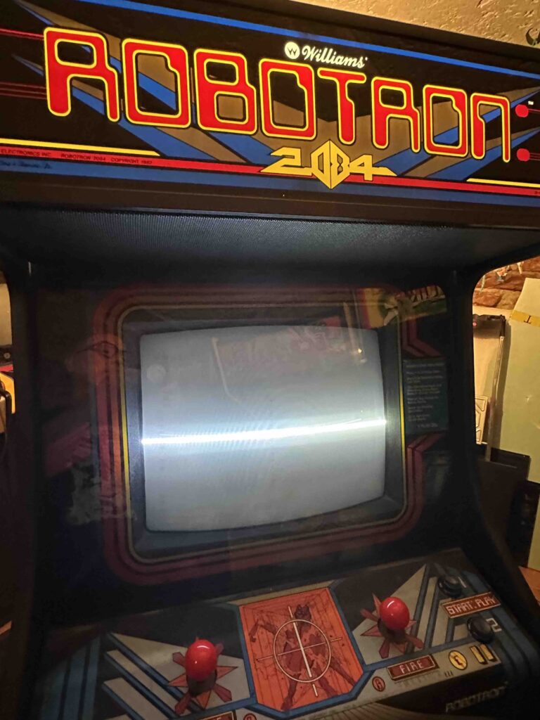 Image of montiro with horizontal line through middle in a Robotron cabinet